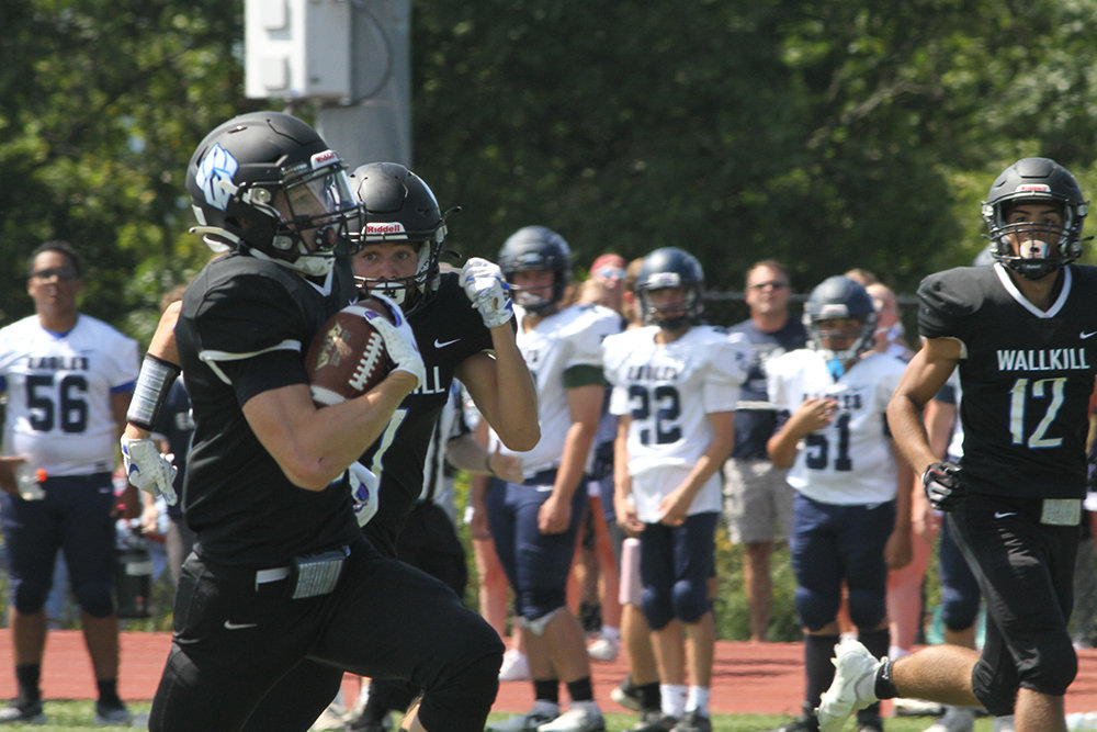 Wallkill receiver Jack Rauschenback pulls in a pass for Wallkill’s first touchdown of the season.
